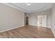 Spacious bedroom with tray ceiling and hardwood floors at 10346 Strongbow Rd, Fishers, IN 46040