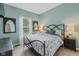 Bedroom showcasing a queen-size bed, neutral walls, and natural light at 10346 Strongbow Rd, Fishers, IN 46040
