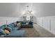 Bonus room with a vaulted ceiling, a ceiling fan, and a large sectional sofa at 10346 Strongbow Rd, Fishers, IN 46040