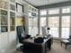 Charming home office with built-in shelving, a large window, and a comfortable leather chair at 10346 Strongbow Rd, Fishers, IN 46040