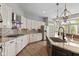 Modern kitchen with granite countertops, stainless steel appliances, island, and ample cabinet space at 10346 Strongbow Rd, Fishers, IN 46040