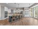 Gourmet kitchen featuring granite countertops, stainless steel appliances, island with barstool seating, and pantry at 10346 Strongbow Rd, Fishers, IN 46040