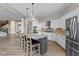 Open concept kitchen with island, granite countertops, stainless appliances and hardwood floors at 10346 Strongbow Rd, Fishers, IN 46040