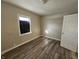 Simple bedroom with new flooring and neutral walls at 1118 N Dearborn St, Indianapolis, IN 46201