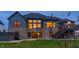 House exterior featuring a stone facade, large windows, and a deck at 1372 N Stoney Brook, Greenfield, IN 46140