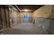 Unfinished basement room with one window and concrete walls at 1372 N Stoney Brook, Greenfield, IN 46140