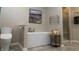 Modern bathroom featuring a freestanding soaking tub at 1372 N Stoney Brook, Greenfield, IN 46140