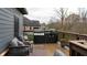 Relaxing deck with built-in grill, seating area, and view of backyard at 1372 N Stoney Brook, Greenfield, IN 46140