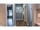 Hallway with gray walls, wood flooring, and access to other rooms at 1372 N Stoney Brook, Greenfield, IN 46140