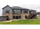 Gray house with stone accents, large windows, deck, and hot tub at 1372 N Stoney Brook, Greenfield, IN 46140