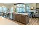 Kitchen island with seating, quartz countertops and wood accents at 1372 N Stoney Brook, Greenfield, IN 46140
