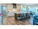 Modern kitchen with large island, stainless steel appliances, and white cabinets at 1372 N Stoney Brook, Greenfield, IN 46140