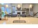 Open concept kitchen flows into Gathering room with a fireplace at 1372 N Stoney Brook, Greenfield, IN 46140