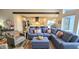 Open living room showcasing a sectional sofa and view into a modern kitchen at 1372 N Stoney Brook, Greenfield, IN 46140