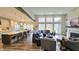 Open-concept kitchen, living, and dining area with hardwood floors and island at 1372 N Stoney Brook, Greenfield, IN 46140
