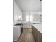 Modern kitchen with white cabinets, center island, and stainless steel appliances at 1667 Midland Main St, Westfield, IN 46074