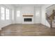 Spacious living room with fireplace and wood-look flooring at 1667 Midland Main St, Westfield, IN 46074
