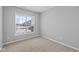 Bedroom with neutral carpet, features a bright window and a view of the outside at 16946 Cattle Hollow Ln, Noblesville, IN 46060