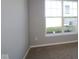 Simple bedroom with large window and carpet at 16946 Cattle Hollow Ln, Noblesville, IN 46060