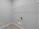 Neutral-colored laundry room with wire shelving and washer/dryer hookups at 16946 Cattle Hollow Ln, Noblesville, IN 46060