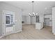 Bright and airy living room and kitchen area with wood floors and modern finishes at 16946 Cattle Hollow Ln, Noblesville, IN 46060
