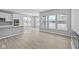 Open concept living room and kitchen area with natural light from large windows at 16946 Cattle Hollow Ln, Noblesville, IN 46060