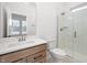 Bathroom featuring wood vanity with stone countertop and a glass shower with tile surround at 19566 Wood Farm Pl, Westfield, IN 46074