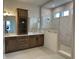 Bathroom featuring double sinks, granite countertops, wood cabinets and an enclosed tiled shower at 19566 Wood Farm Pl, Westfield, IN 46074