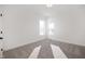 Bright bedroom featuring neutral walls, plush carpeting, and natural light from double-hung windows at 19566 Wood Farm Pl, Westfield, IN 46074