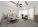 Vaulted ceiling bedroom with ceiling fan, a large window, decorative rug, and neutral decor at 19566 Wood Farm Pl, Westfield, IN 46074