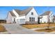 Beautiful two-story home with a two car garage, stone base, and a sidewalk at 19566 Wood Farm Pl, Westfield, IN 46074