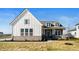 Charming two-story home with a stone base, white siding, and a cozy front porch at 19566 Wood Farm Pl, Westfield, IN 46074