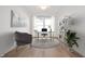 Stylized home office with modern furniture, hardwood floors, and bright natural light at 19566 Wood Farm Pl, Westfield, IN 46074