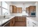 Bright kitchen featuring stainless appliances, white counters, custom cabinets, and wood floors at 19566 Wood Farm Pl, Westfield, IN 46074