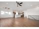 Open concept living area showcasing the staircase, windows, and hardwood floors at 19566 Wood Farm Pl, Westfield, IN 46074
