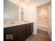 Bathroom features a double sink vanity with dark wood cabinets, and a shower/tub combo at 248 Highland Ave, Danville, IN 46122