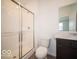 Modern bathroom features a glass shower and dark wood vanity with white countertop at 248 Highland Ave, Danville, IN 46122