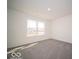 The bedroom features neutral carpet, and a large window providing bright natural light at 248 Highland Ave, Danville, IN 46122