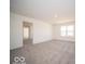 Spacious carpeted bedroom with a view of neighborhood through a window at 248 Highland Ave, Danville, IN 46122