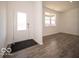 Bright foyer with hardwood floors, a white front door, and ample natural light at 248 Highland Ave, Danville, IN 46122