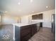 Modern island kitchen with stainless steel appliances and abundant natural light at 248 Highland Ave, Danville, IN 46122