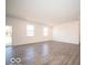 Large, open living room with wood-look floors and plenty of natural light at 248 Highland Ave, Danville, IN 46122