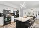 Modern kitchen with black appliances and a large island at 2746 Cadogan Dr, Greenwood, IN 46143