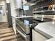 Modern kitchen with stainless steel appliances and quartz countertops at 3271 Winthrop Ave, Indianapolis, IN 46205