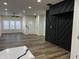 Spacious living area showcasing hardwood floors and a modern wall at 3271 Winthrop Ave, Indianapolis, IN 46205