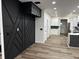 Modern living room with geometric dark accent wall and light wood floors at 3271 Winthrop Ave, Indianapolis, IN 46205