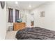 Comfortable bedroom featuring a dresser with TV, soft carpet, and natural light at 359 Terrace Ave, Indianapolis, IN 46225