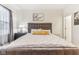This bedroom features a tufted headboard, soft carpet, and natural light at 359 Terrace Ave, Indianapolis, IN 46225