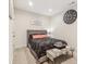 Cozy bedroom featuring soft carpet, neutral walls, a decorative wall clock and stylish décor at 359 Terrace Ave, Indianapolis, IN 46225