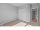 Well-lit bedroom with carpet flooring and double doors leading to another room at 3950 Bozeman Way, Bargersville, IN 46106